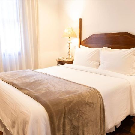 Hotel Solar Do Rosario أورو بريتو المظهر الخارجي الصورة A bed